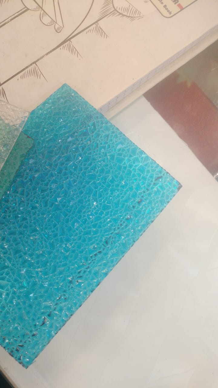 Aqua/teal polycarbonate diamond sheet with shattered-glass diamond texture and sparkling finish.