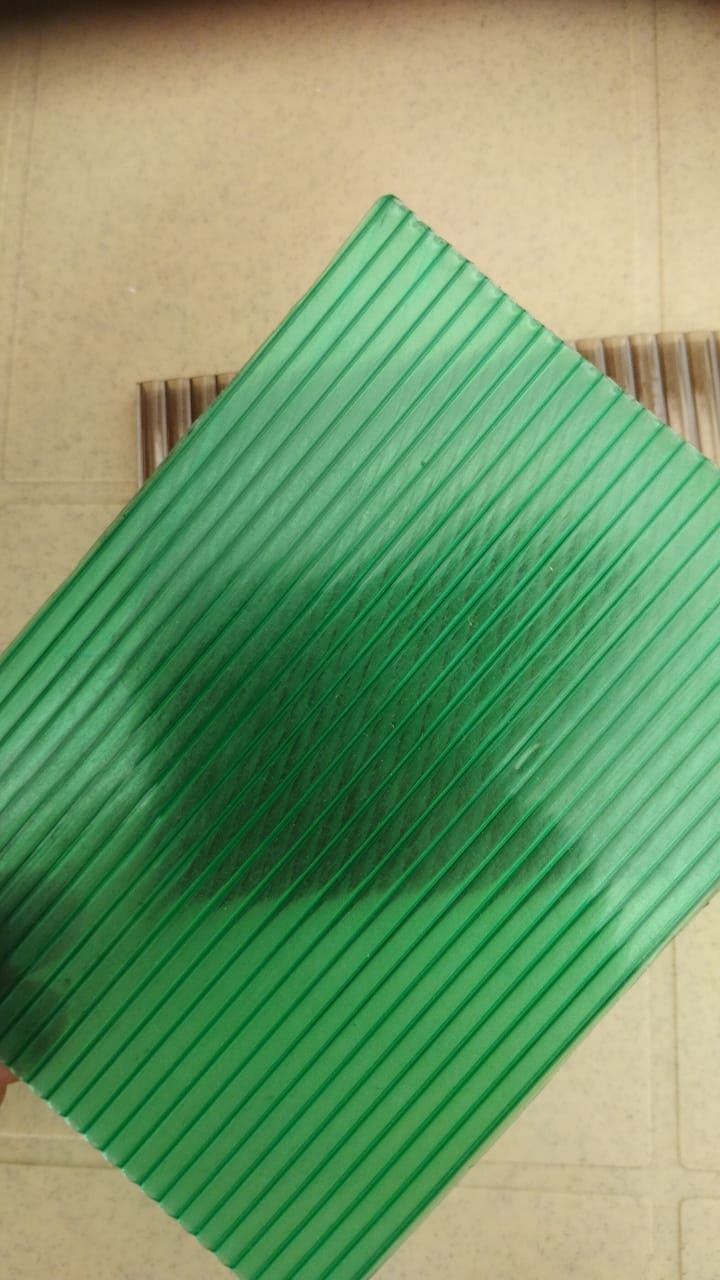 Green translucent multiwall sheet on tiled surface, highlighting multiwall construction.